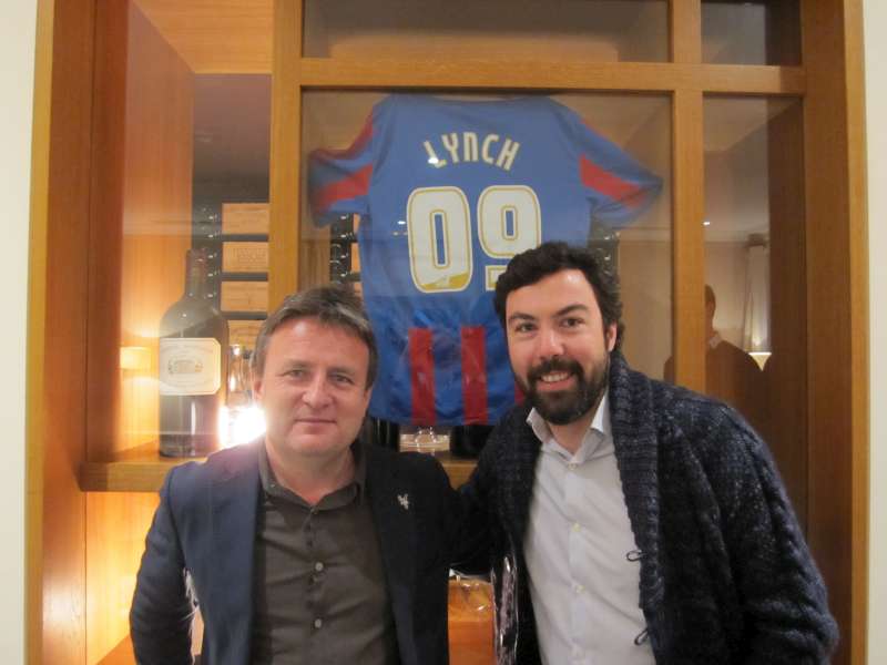Stephen Browett and Jean-Charles Cazes pose with a Lynch Bages Crystal Palace shirt
